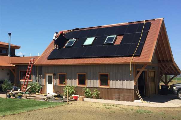 Installing solar panels on a home in Teton Valley, Idaho